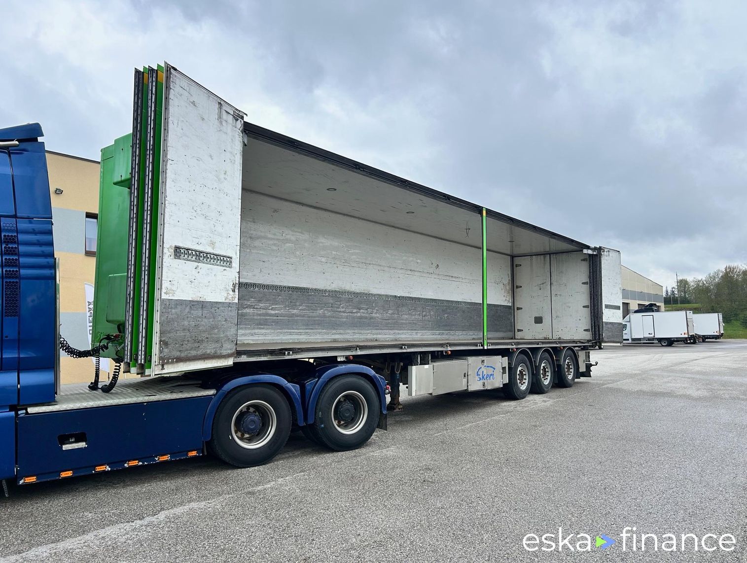 Leasing Semi-trailer Ekeri SIDE OPENING + LAST AXLE STEERING + BOX HEATING 2013