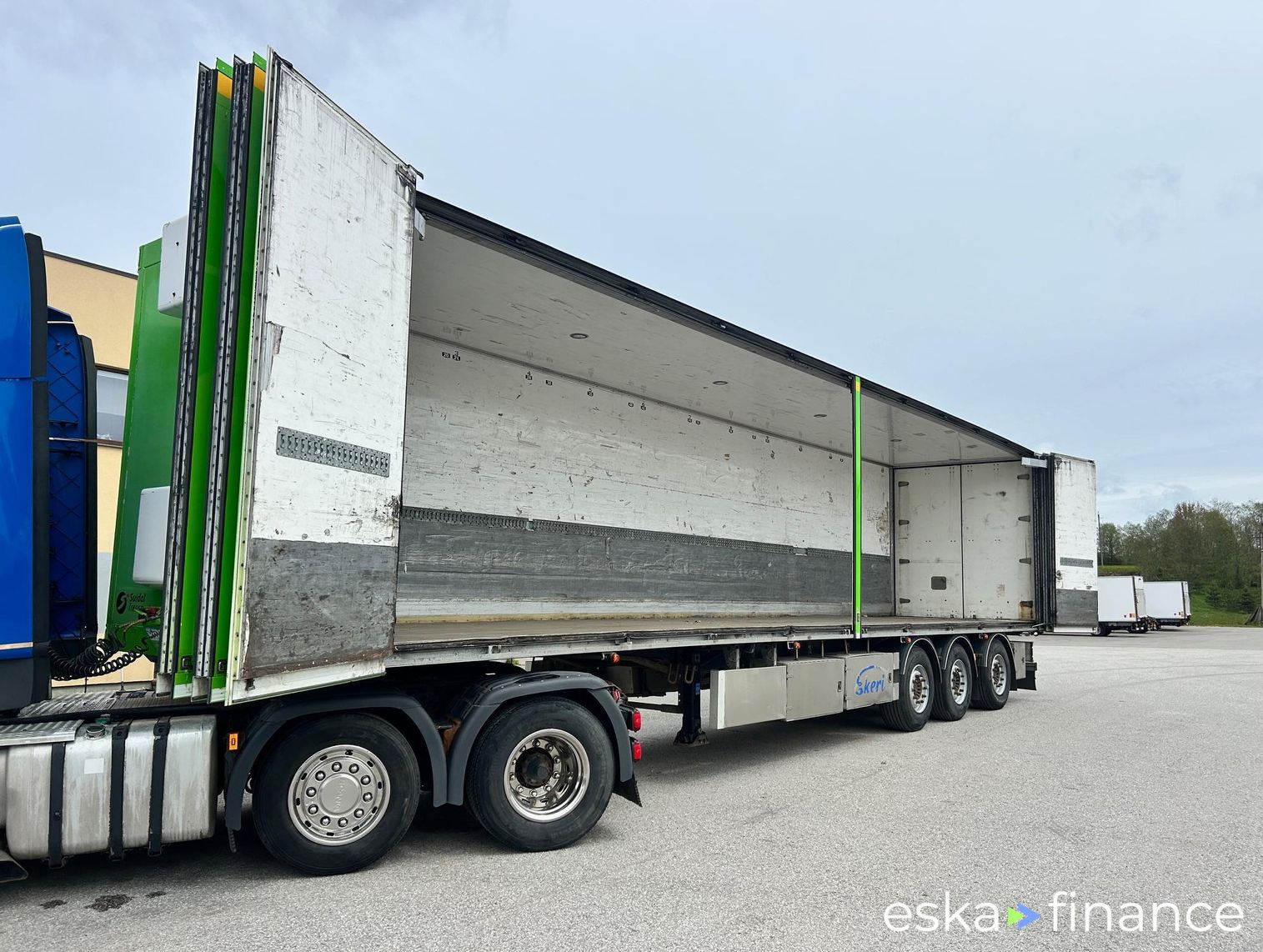 Leasing Semi-trailer Ekeri SIDE OPENING + LAST AXLE STEERING + BOX HEATING 2013